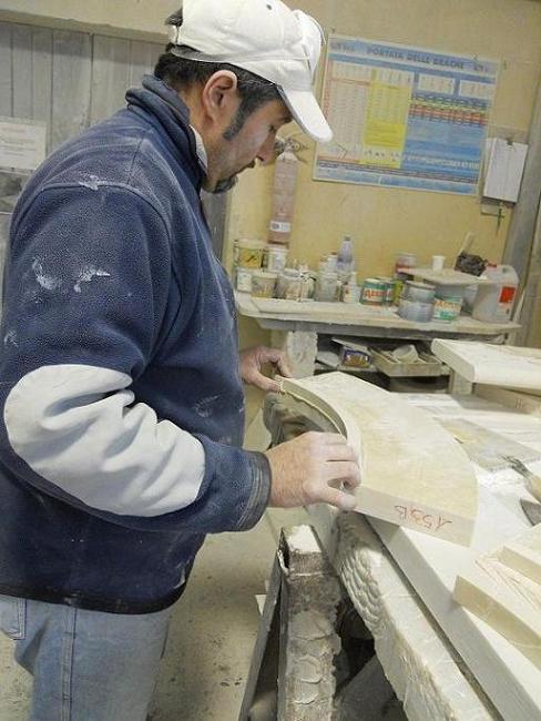 Skilled worker doing manual work on each marble pieces of fountain