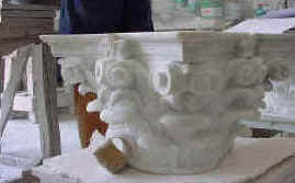 Capital for the columns, in the same Carrara White marble