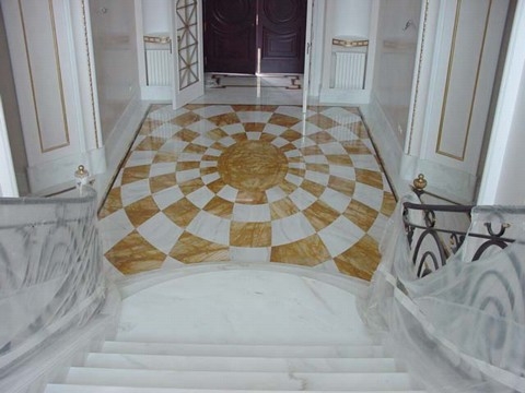 Marble floor, stair, and solid element in marble Calacatta & giallo siena marble